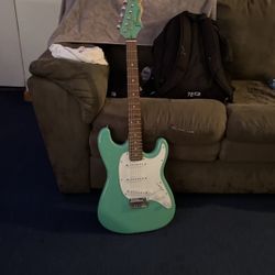 electric guitar, teal, general size 