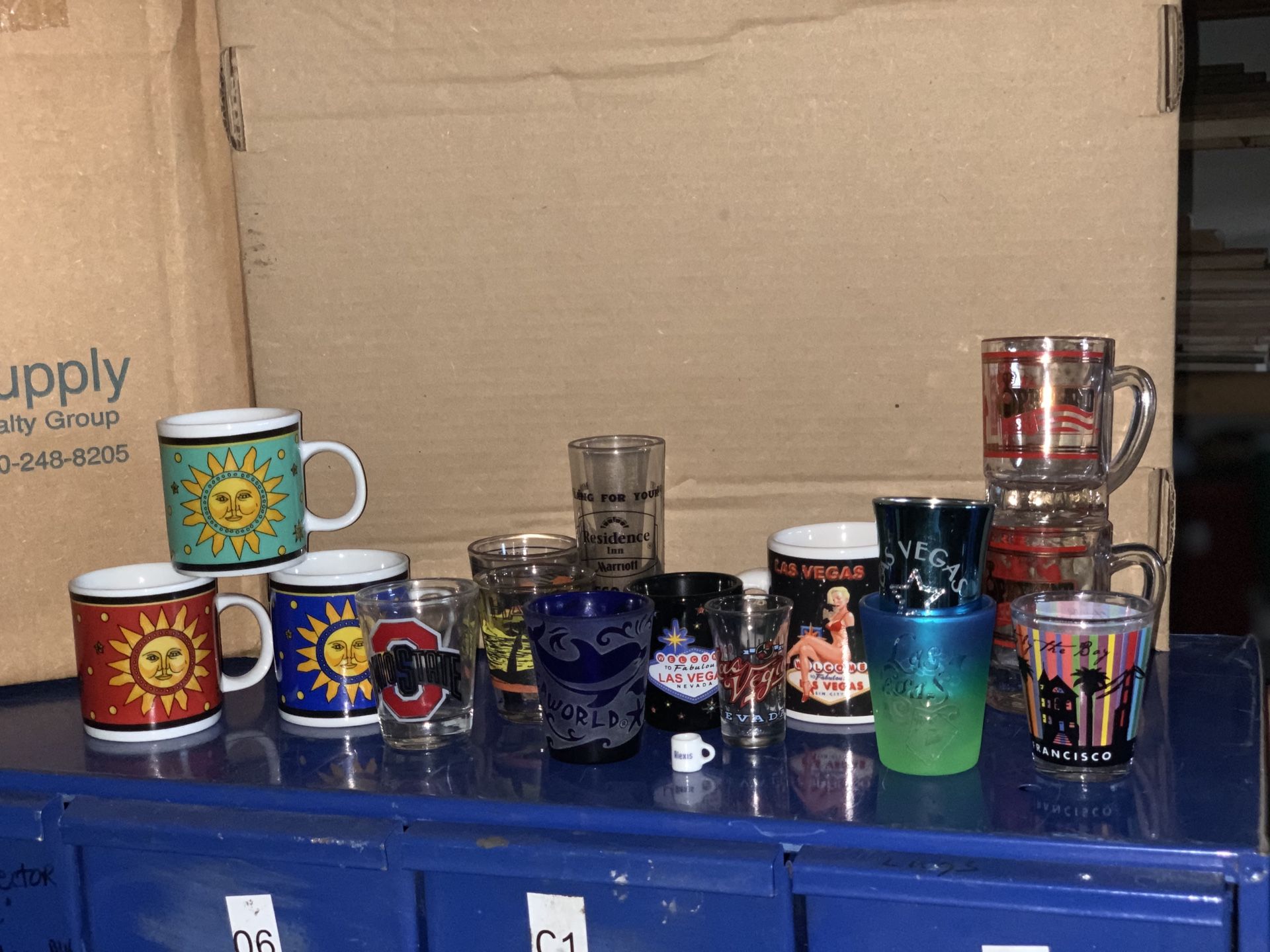 Shot glass collection with mini mugs. Las Vegas, San Francisco, Ohio state, sea world, etc