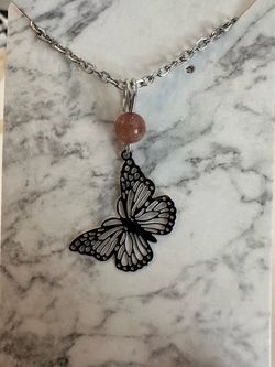 New, beautiful Strawberry Quartz Crystal butterfly necklace. Shipping available.