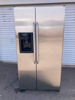 GE side by side refrigerador de acero inoxidable en buenas conficionrs limpio y agradable un mes de garantía entrega disponible dimensiones W36-D31-H6