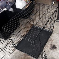 Foldable dog or cat cage 24x36x24 Condition: Used in good condition  