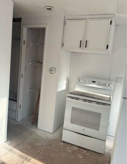 White fridge and electric stove / over the range microwave