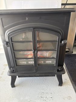 Electric fireplace heater works really well and very cute