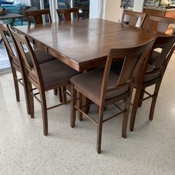 PRICED TO SELL!!   $450 Or Best Offer Counter Height Extendable Wood Dining Table Includes 8 Counter Height Barstools 