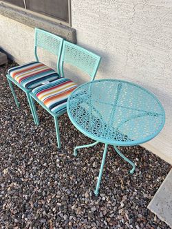 Small table and chairs with cushions