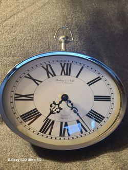Silver Oval Sterling & Noble Wall Clock