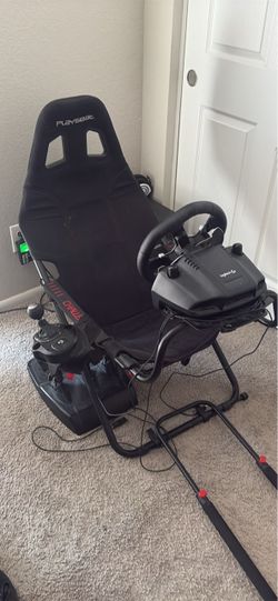 Logitech steering wheel with gearshift and pedals with chair