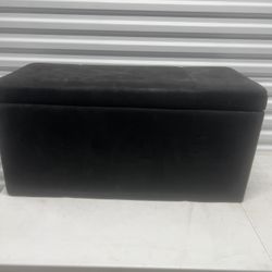 Black storage ottoman used in good condition . Located below  31705 SR-54  Wesley Chapel, FL  33545 storage mart  Formally Metro Self Storage 