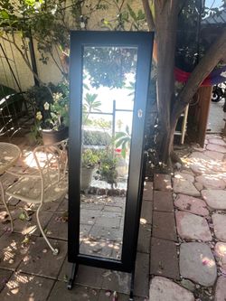 Mirror and jewelry holder