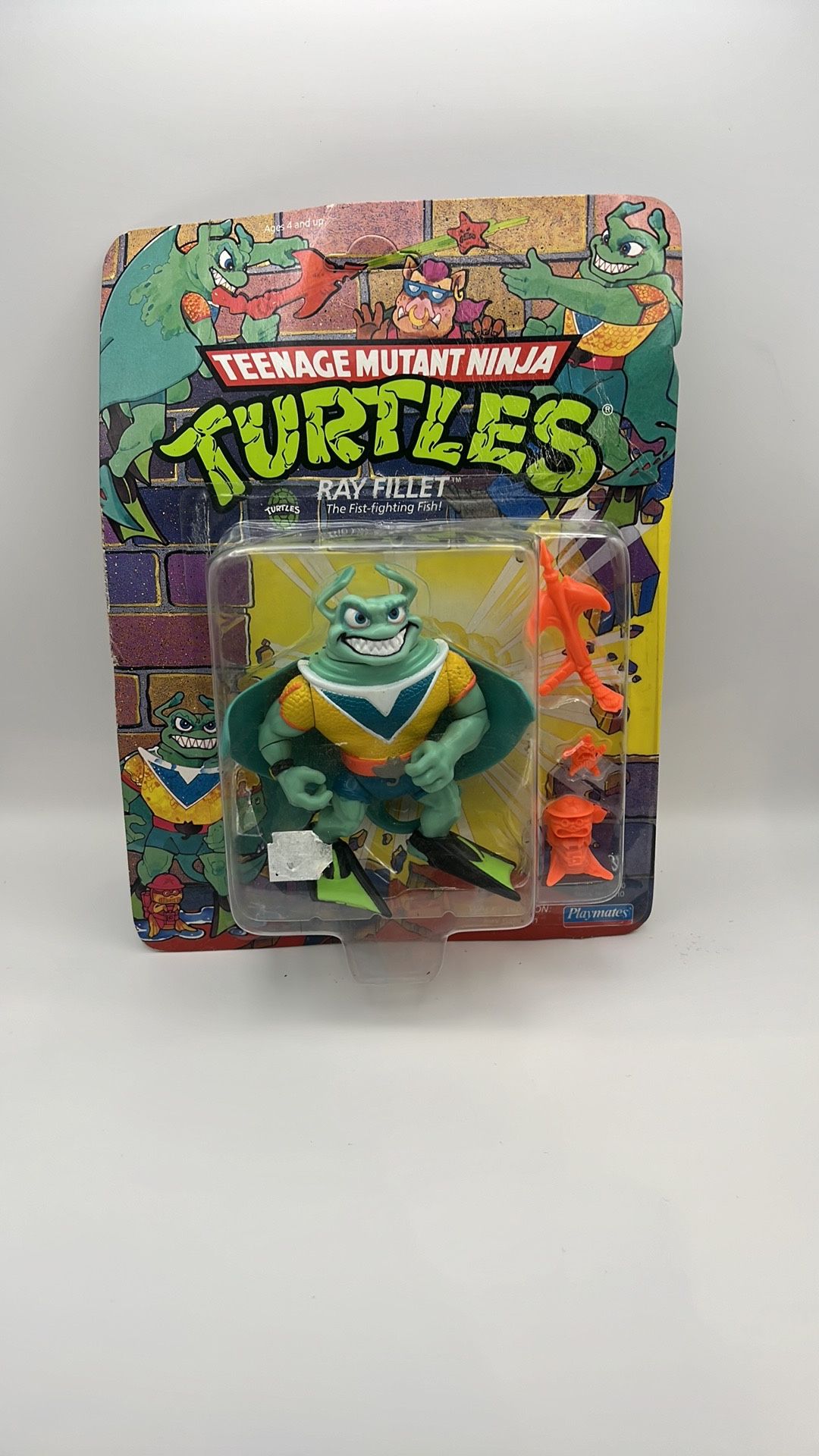 TMNT Teenage Mutant Ninja Turtles Ray Fillet Yellow Variant Playmates 1990. Plastic is lifting on top but has not come loose. Cardboard is bent