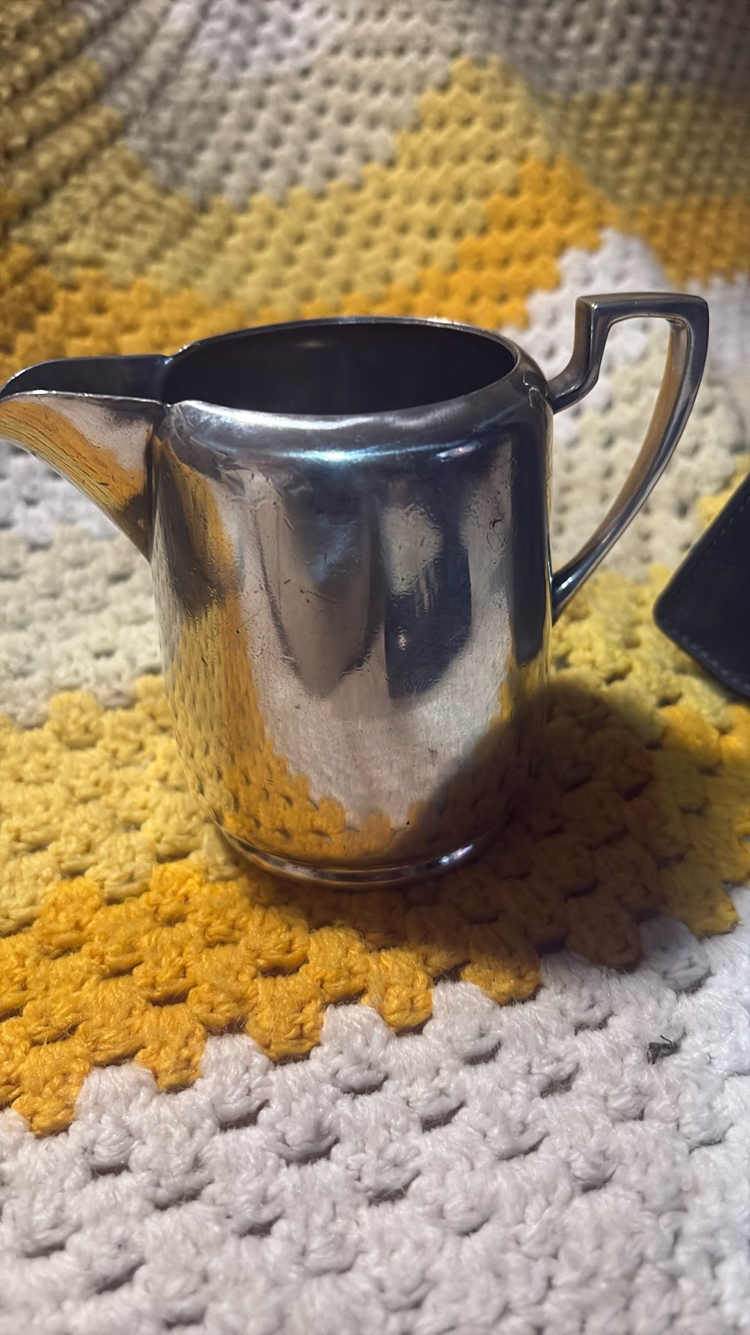 A Vintage Silver Plated Creamer With Hammerd Texture
