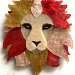 Big Vtg Style Lion Brooch Pin  Layered 3D Acrylic brooch features a lion's head with a mane in shades of red, gold, and beige.