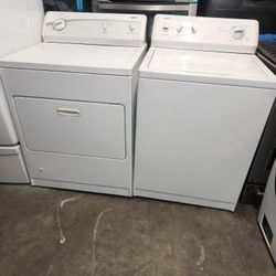 Pair of washing machines are Kenmore brand gas