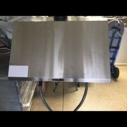 NEW NEVER USED LG SIGNATURE 36” STAINLESS STEEL WITH BLOWER.