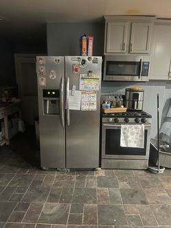 Stainless Steel Side-by-Side Refrigerator with Water and Ice Dispenser