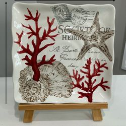 Stamp Sealife Decorative Plate by Maxcera on a Wooden Easel
