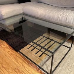 Glass coffee table with steel / iron base