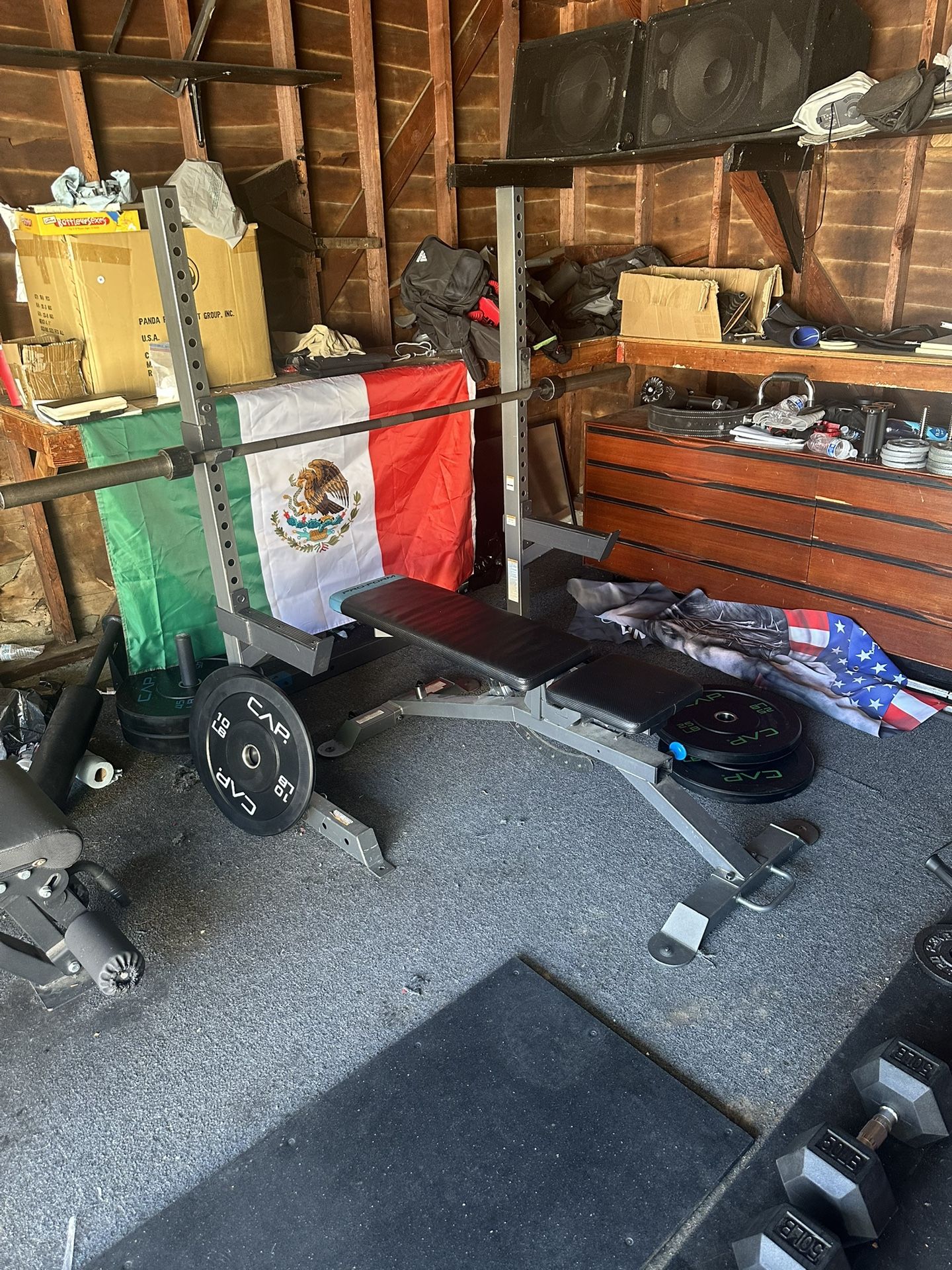 Squat Rack And Adjustable Bench With Barbell And Weights