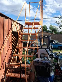 Orange 9ft industrial ladder
