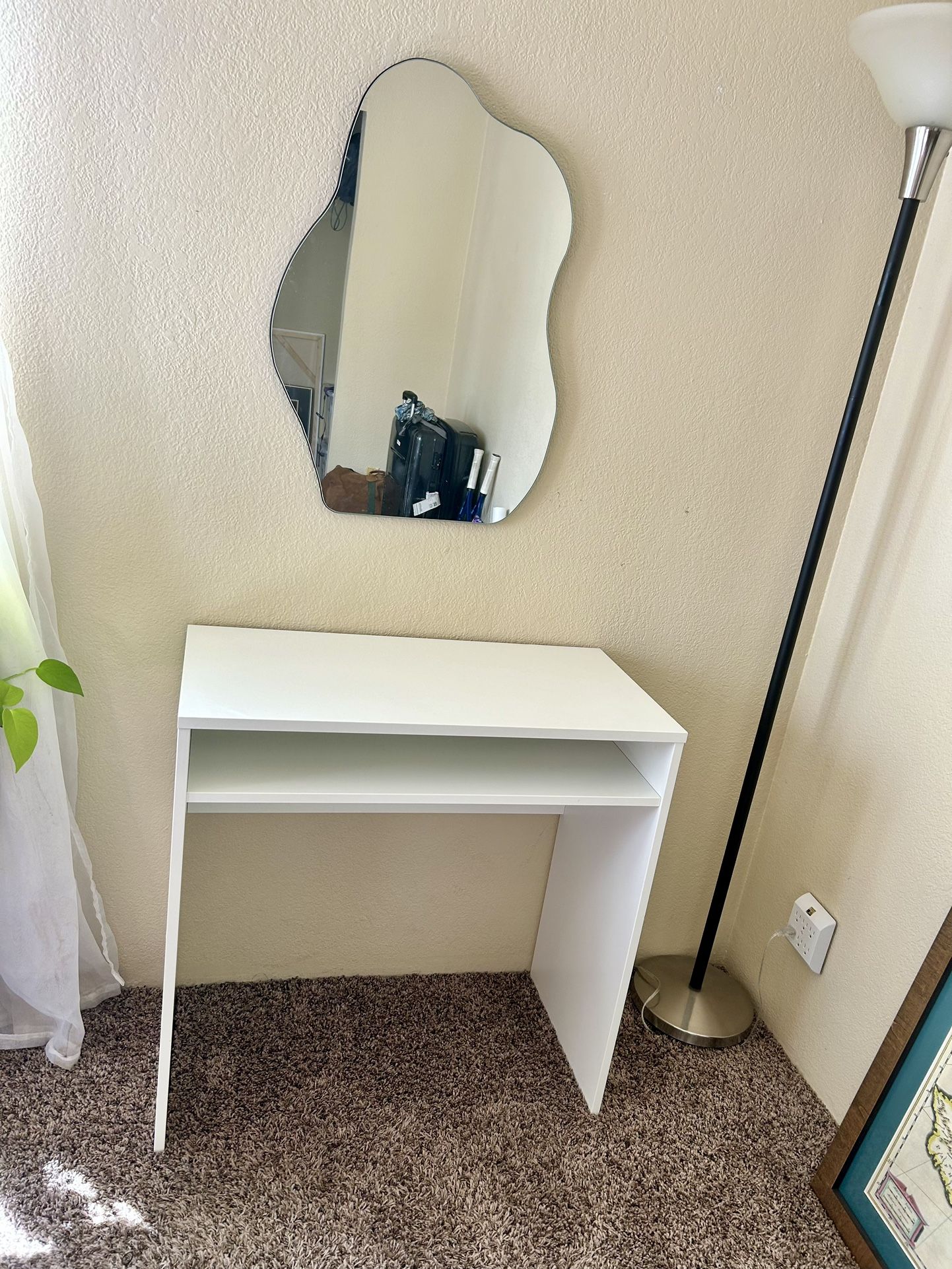 Vanity With Curvy Mirror And White Desk