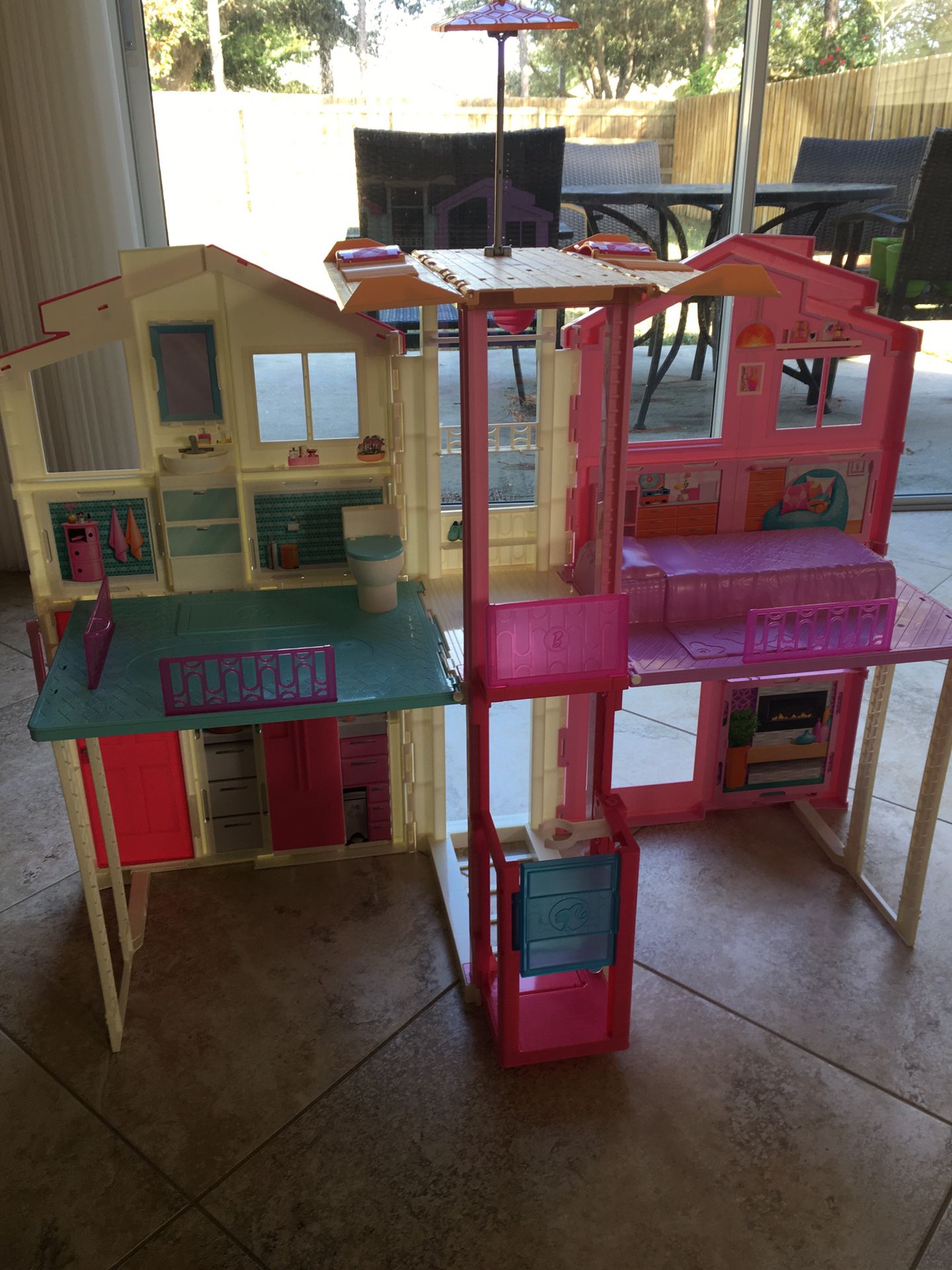 Barbie Town house and accessories/dolls galore
