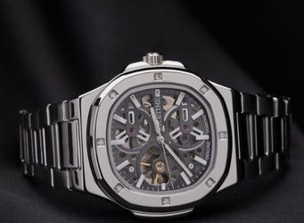 Ice time skeleton men’s 43 mm Automatic skeleton dial SS with genuine diamonds,box included retail price over 900.00 great deal box for watch includ