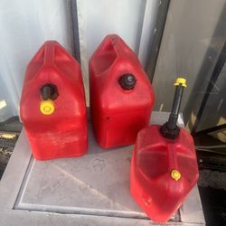2 - 5 Gallon And 1 - 2.5 Gallon Gas Cans 
