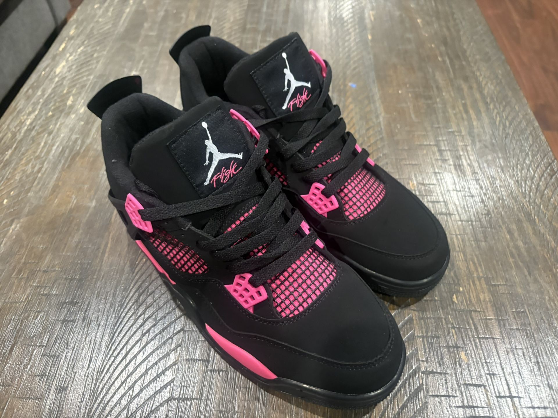 Pink Thunder Jordan 4s