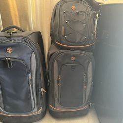 Two Timberland Suitcases And One Backpack