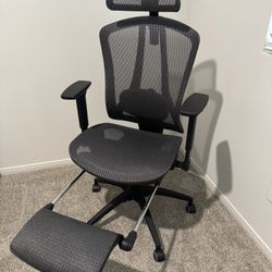 Ergonomic Computer chair with foot rest. Adjustable neck, height, lumbar, and arm rest.