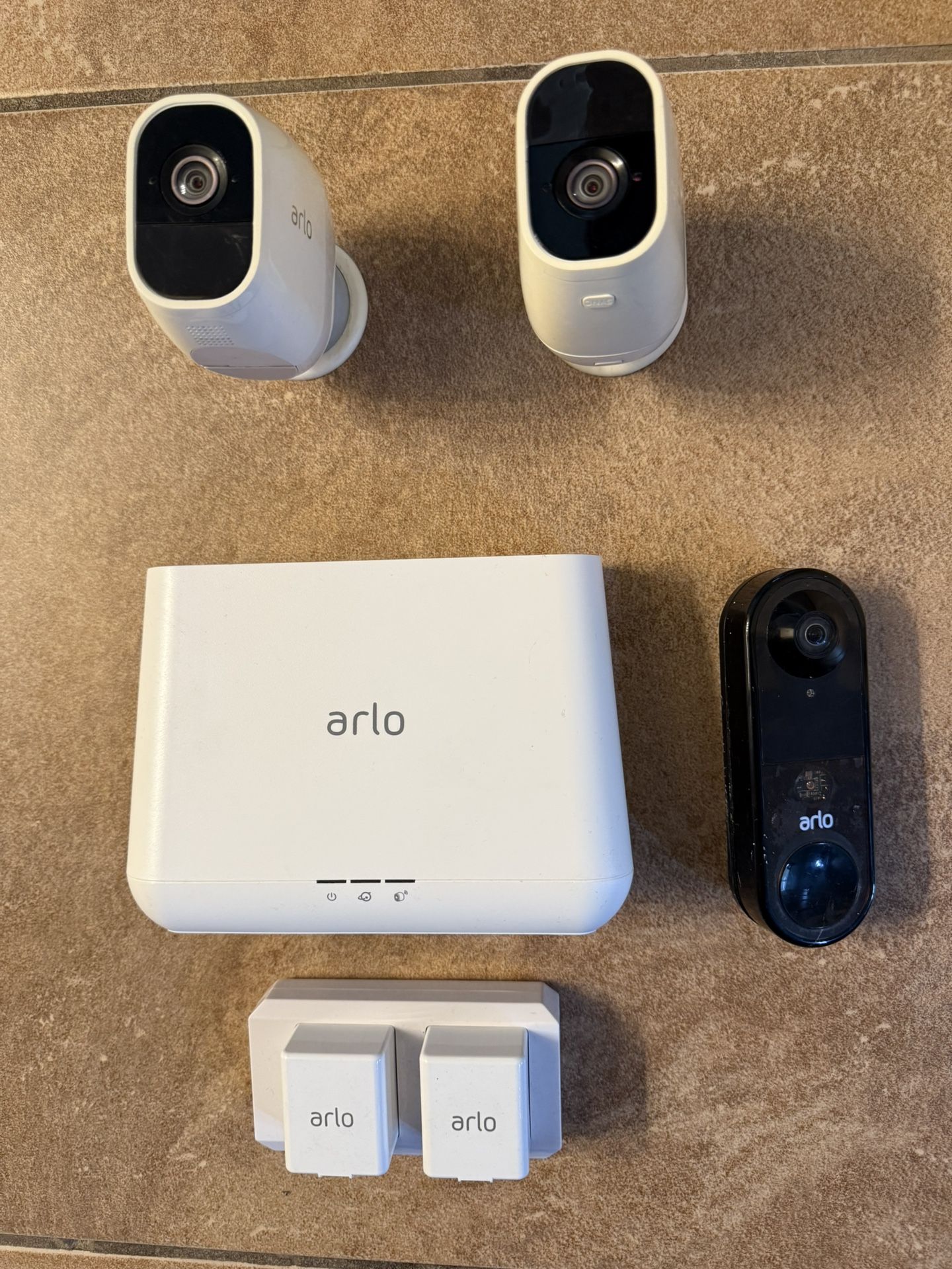 2 Arlo Outdoor Security Cameras, Doorbell, And Base Station