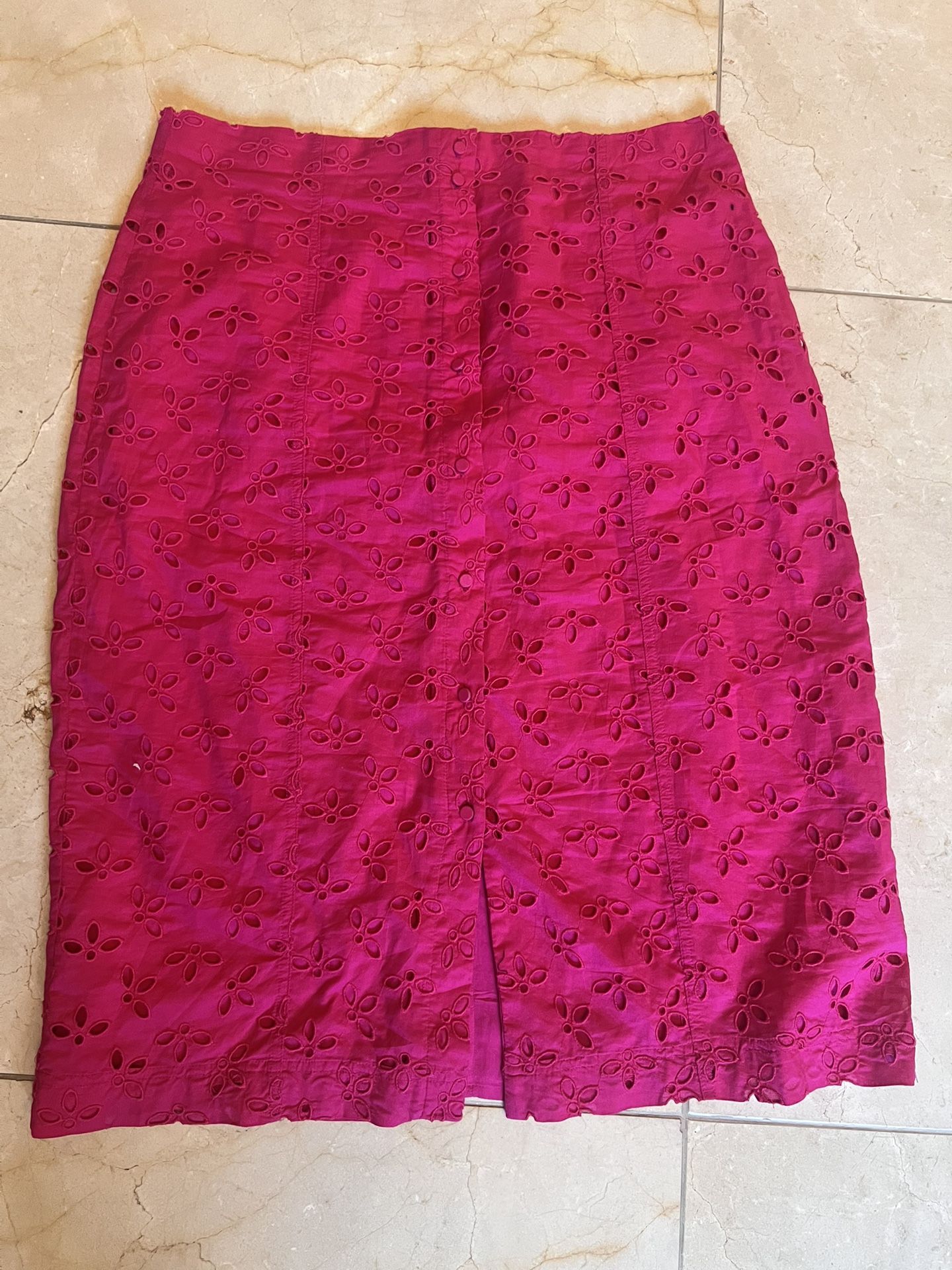 The J. Crew Hot Pink Button Front Cotton Eyelet Pencil Skirt in size 14 is a stylish and feminine addition to any casual outfit. Made from cotton, thi