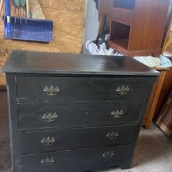 Antique solid wood black dresser. It has the late 1800’s pin and cove construction in the drawers. The size is 39x18x35.5 tall. The drawers slide well