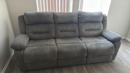 Two electric recliner couches blue grey color