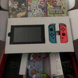 Nintendo switch with three games