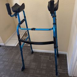 Folding walker with armrest