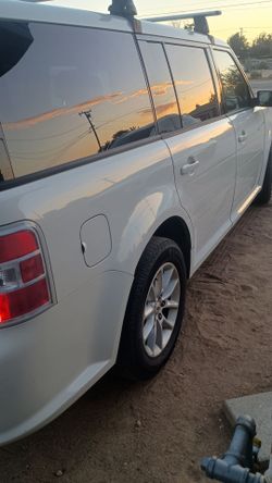 Ford Flex White SUV with Roof Rack