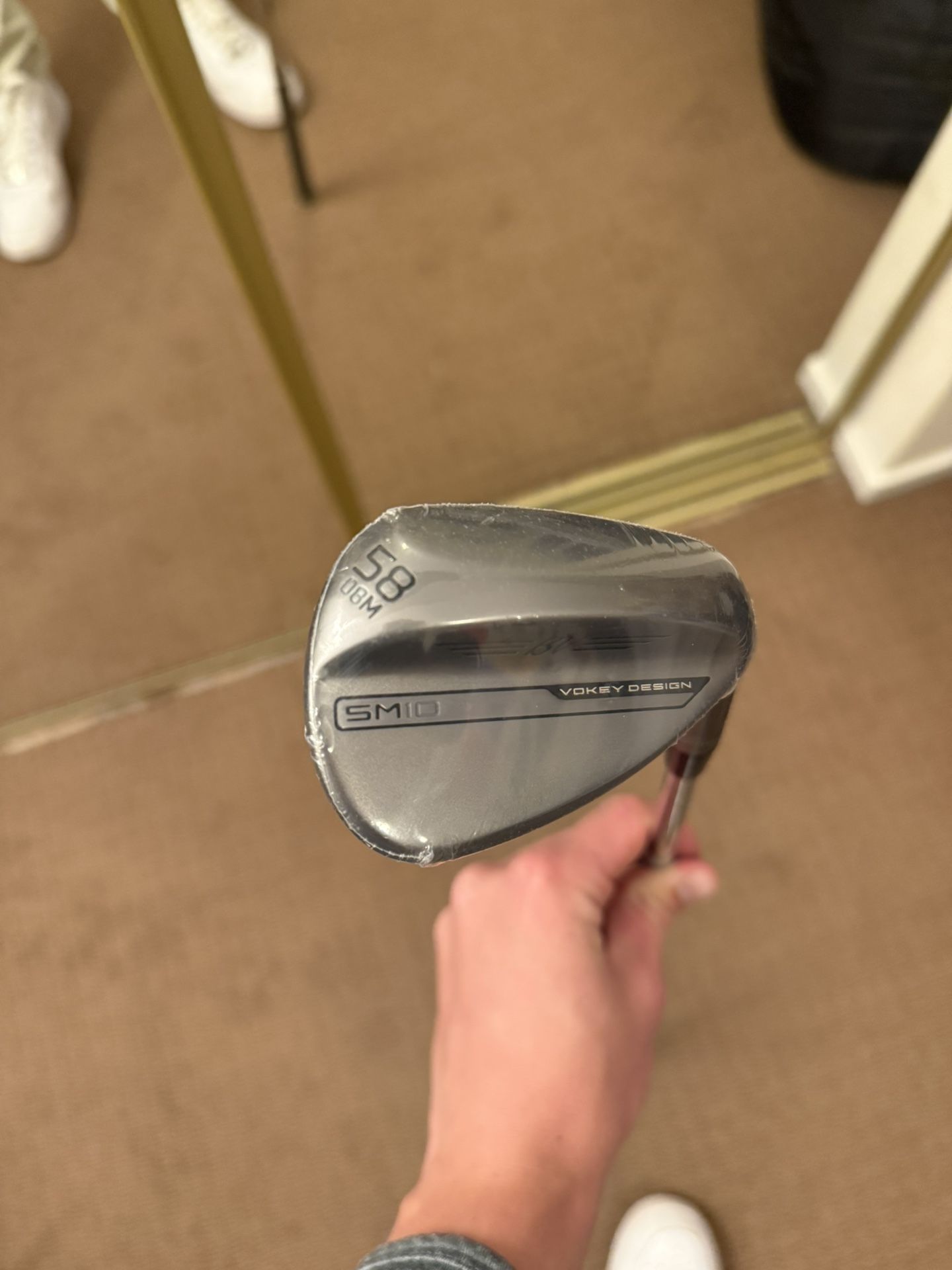 Right-handed Titleist Vokey SM10 58° wedge, 8° bounce, M grind, with a SM10 Wedge Flex (Dynamic Gold S200) shaft.