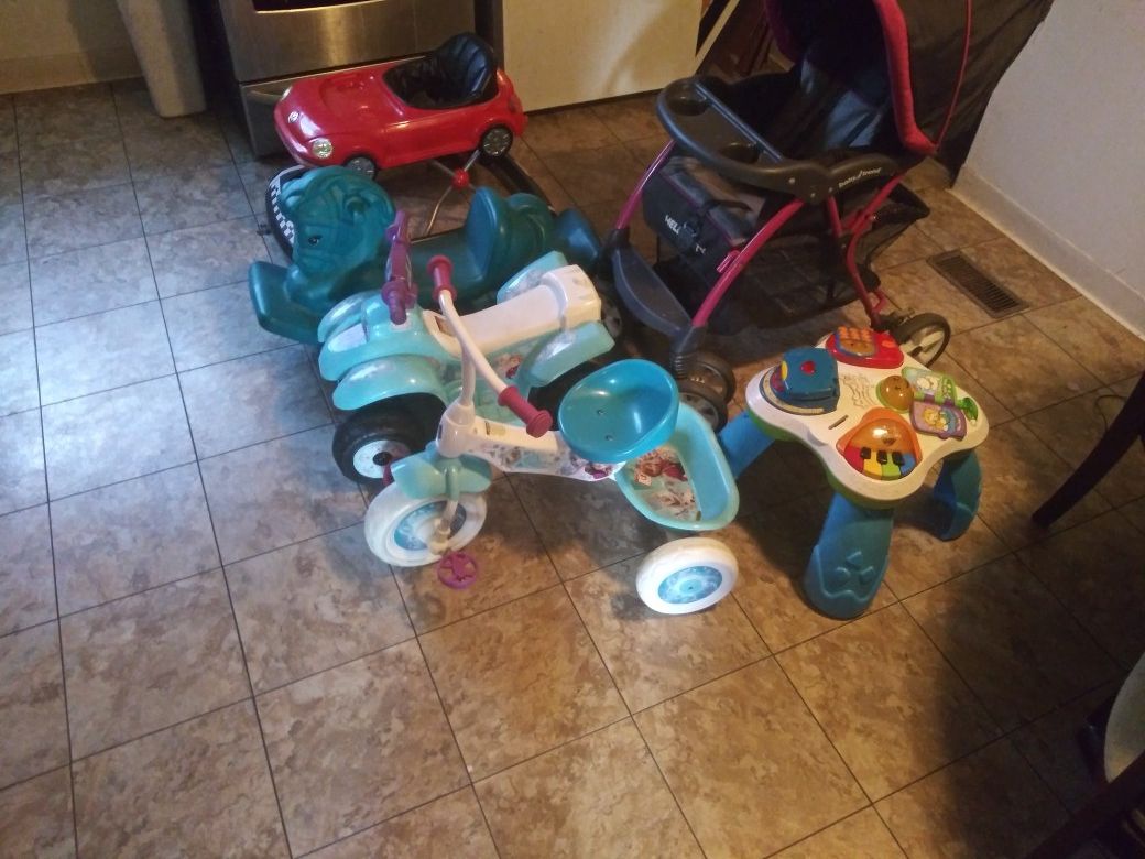 Baby stroller, power wheel, bike, two horses and car