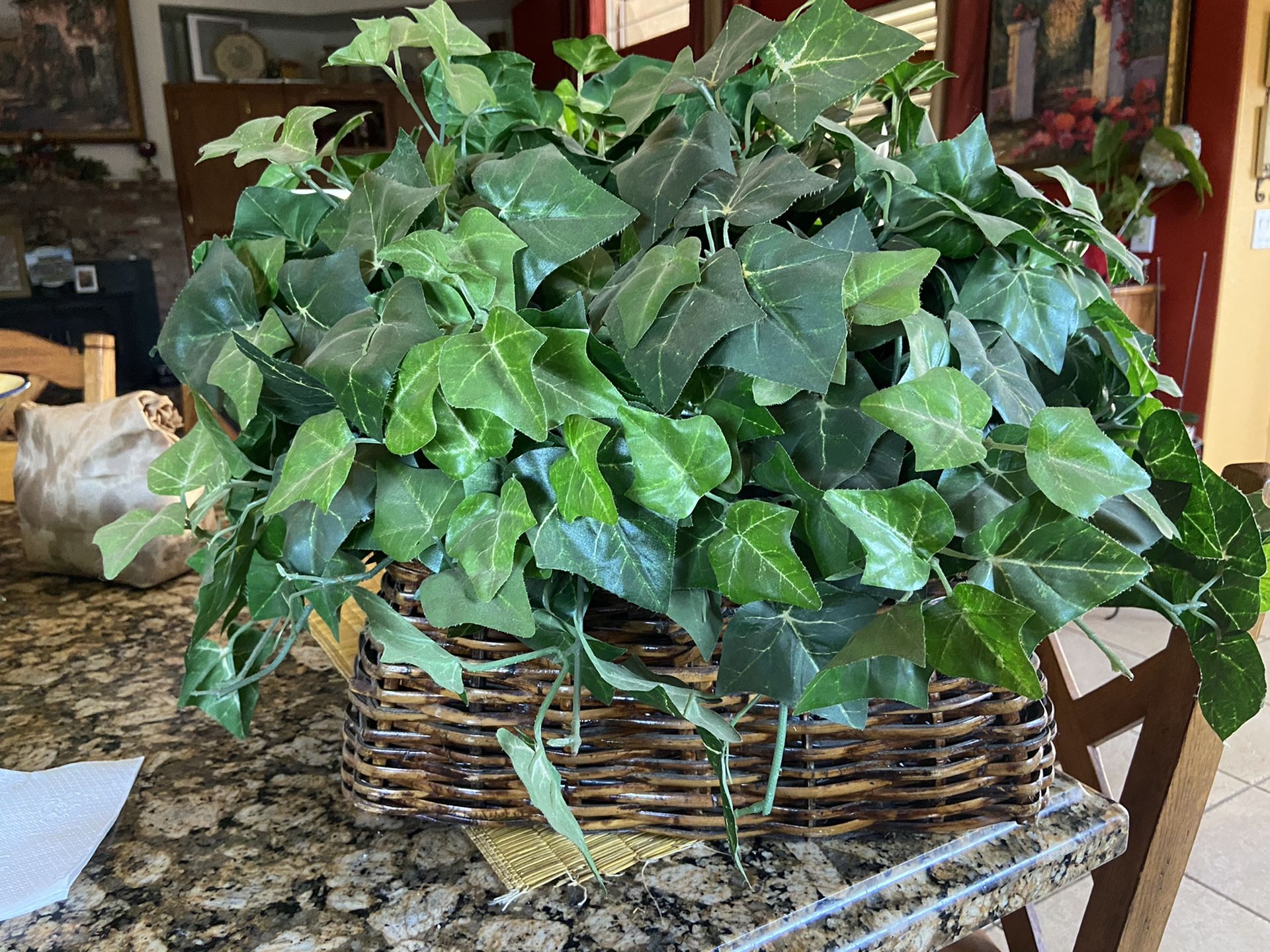 Large fake green plant in basket