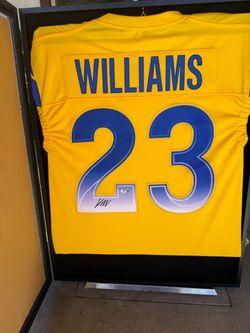 Framed autographed L.A Rams jersey
