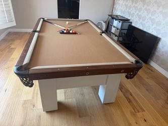Pool Table with Balls and Cue Sticks