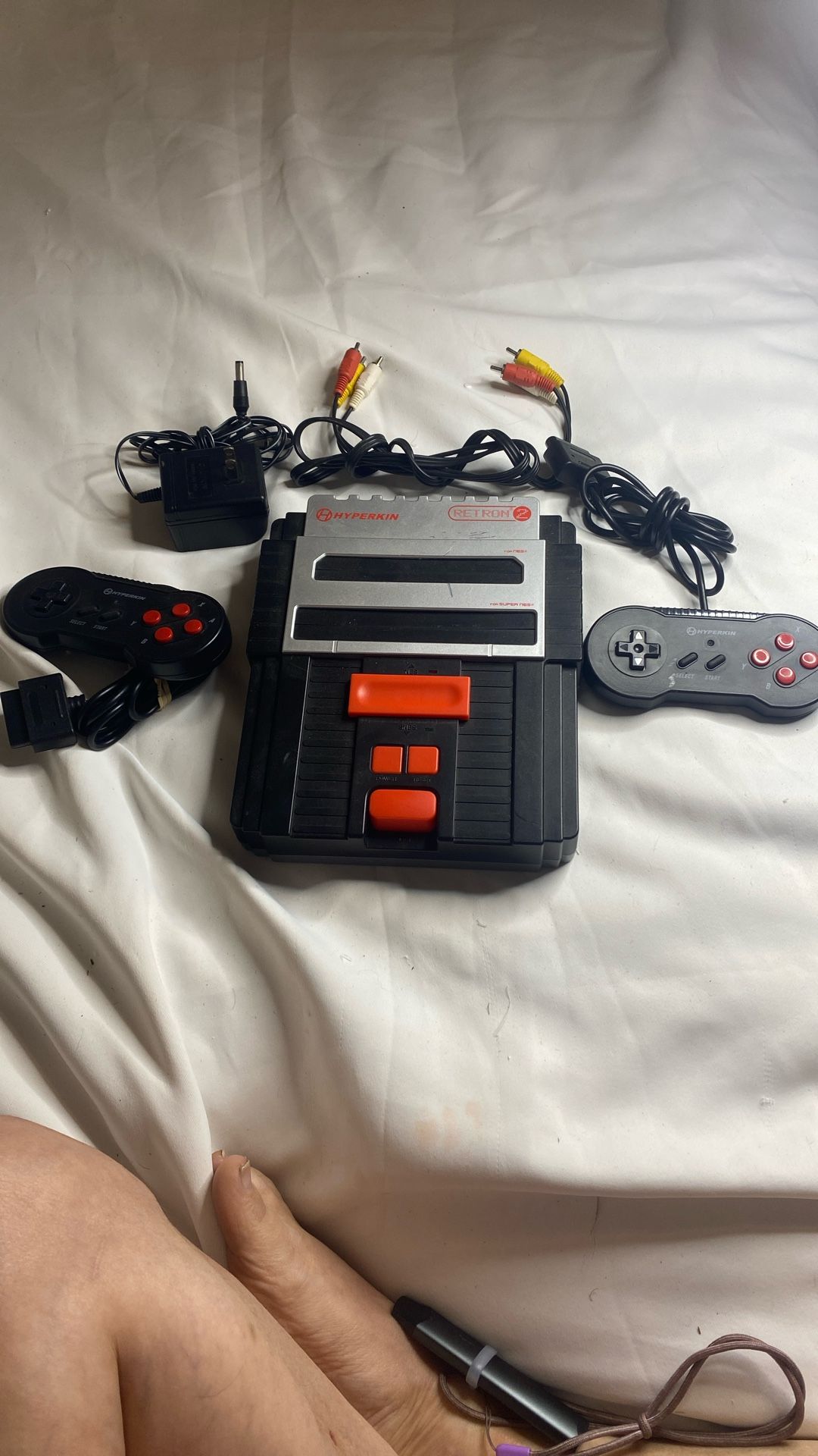 Hyperkin RetroN 2 gaming console, which is a two-in-one system designed to play both original Nintendo Entertainment System (NES) and Super Nintendo E