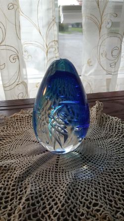 Egg paperweight with a silver twist