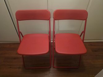 2 red Ikea folding chairs-$30