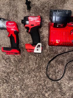 Milwaukee M18 Fuel Impact Driver Set with Charger and flashlight