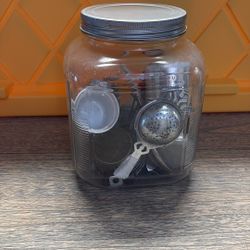 Antique glass jar with tea accessories
