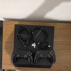 PS4 Pro 1TB + 2 Controllers + Box – Works Great