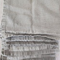 4 Gray Napkins each with phrase