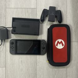 nintendo switch with travel case and games